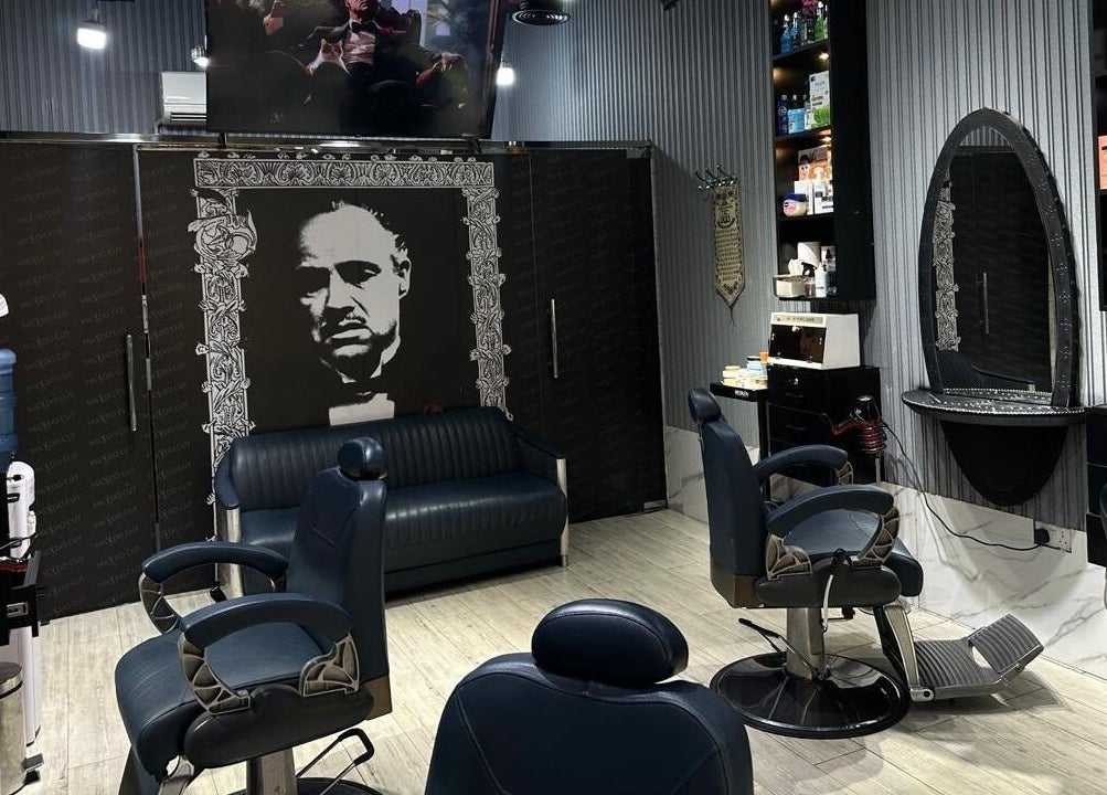 Chic interior of Milado Cut Barber Shop in Dubai, AE, featuring sleek barber chairs and stylish decor.
