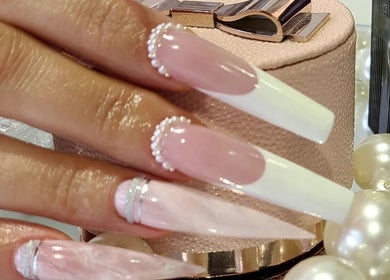 Elegantly manicured nails with pearls at Myrie Beauty, Whitby, Ontario, CA.