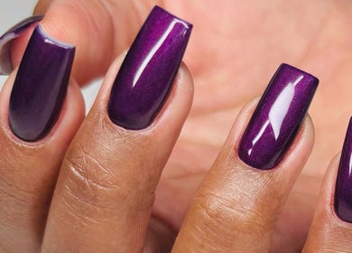 Stylish purple manicure at Myrie Beauty, Whitby, Ontario, CA. Perfectly polished nails showcasing elegance.