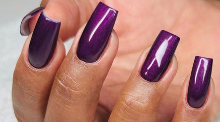 Stylish purple manicure at Myrie Beauty, Whitby, Ontario, CA. Perfectly polished nails showcasing elegance.