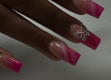 Pink ombre nails with butterfly art at Myrie Beauty, Whitby, Ontario, CA. Elegant and stylish design.