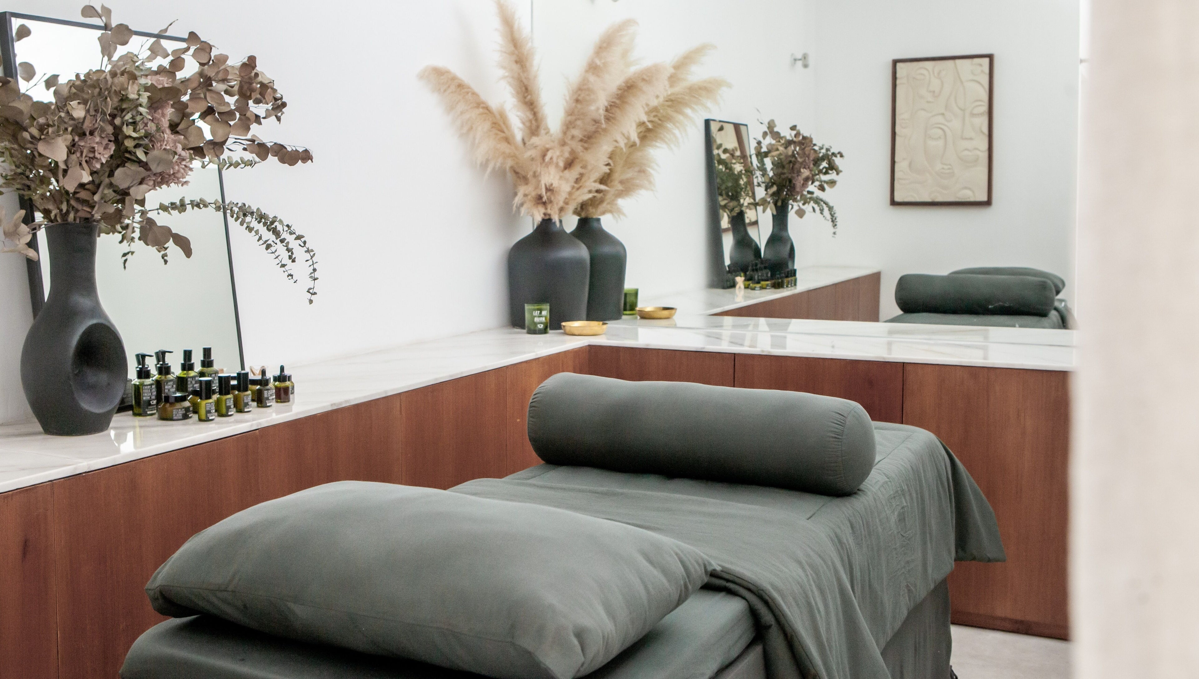Relaxing massage room at Fields of Yarrow Berawa in Bali, Bali, ID with cozy décor and essential oils.