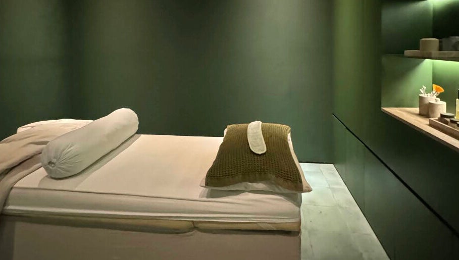 Relaxing massage room at Fields of Yarrow Uluwatu, Bali, Bali, ID featuring cozy bed and soothing ambiance.