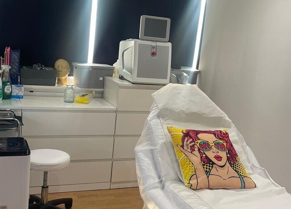 Modern treatment room at Simply Ella, Chelmsford, England, GB with vibrant decor and advanced equipment.