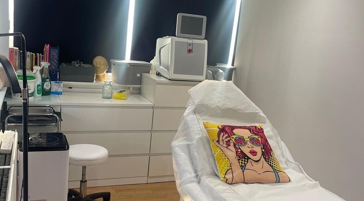 Modern treatment room at Simply Ella, Chelmsford, England, GB with vibrant decor and advanced equipment.