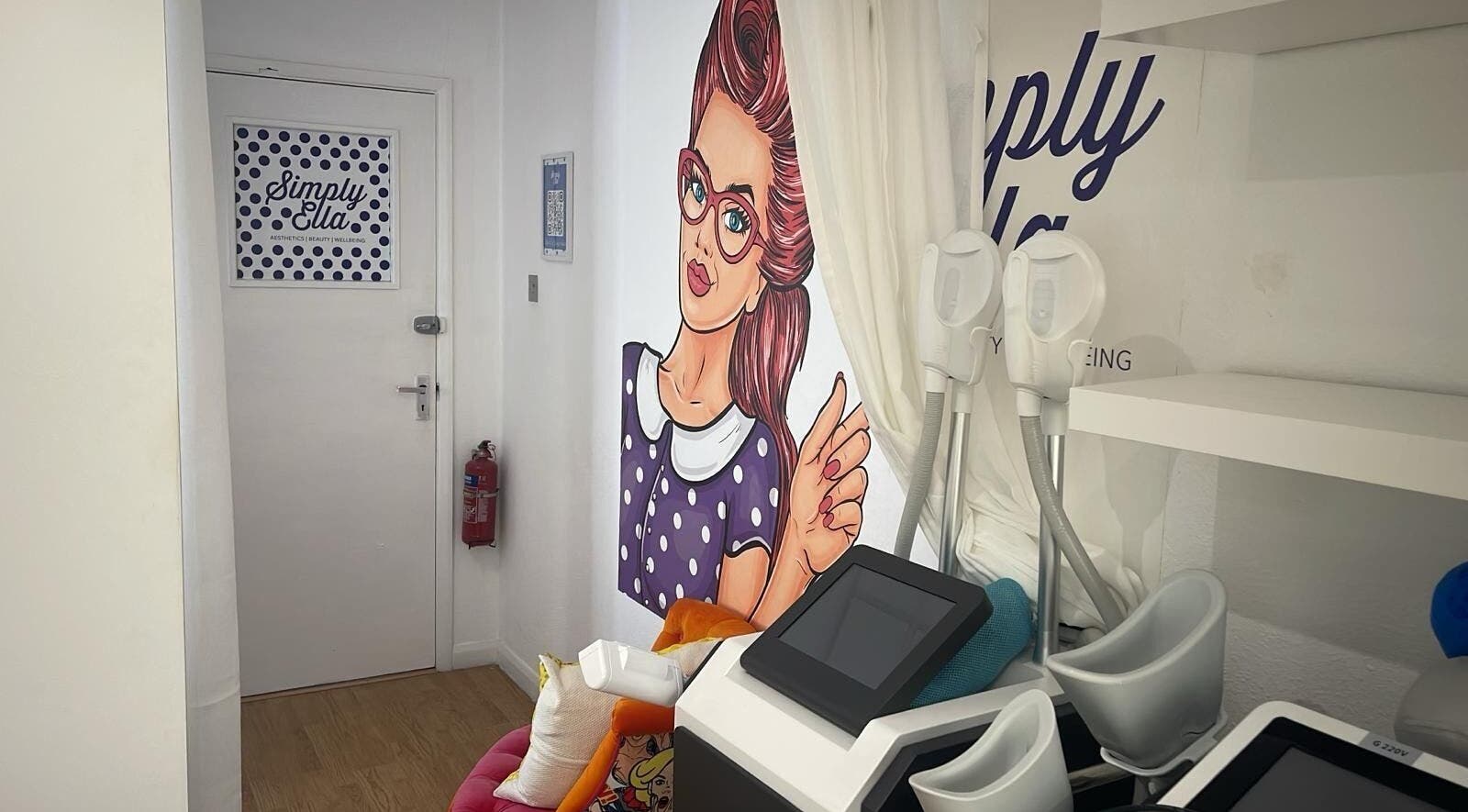 Simply Ella's colorful treatment room in Chelmsford, England, GB, featuring modern equipment.