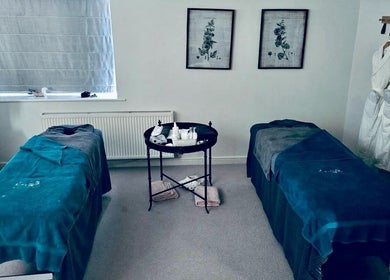 Relaxing therapy room at Beauty Within by Vicky in Bishop Auckland, England, GB with treatment tables and robes.