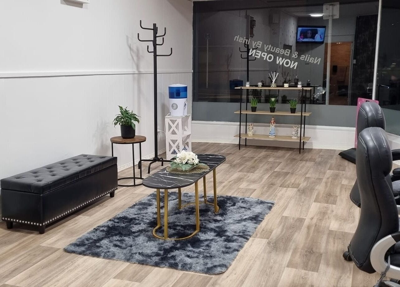 Chic interior of Nails and Beauty by Irish, Dunedin, Otago, NZ, featuring plush seating and modern decor.