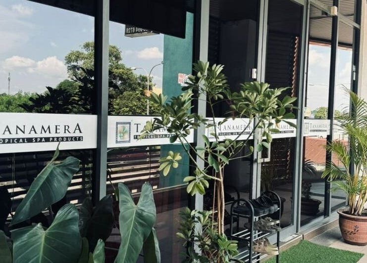 Entrance of Tanamera Spa Kemaman Arked in Chukai, Terengganu, MY with tropical plants and glass doors.