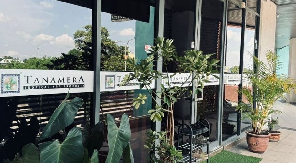 Entrance of Tanamera Spa Kemaman Arked in Chukai, Terengganu, MY with tropical plants and glass doors.
