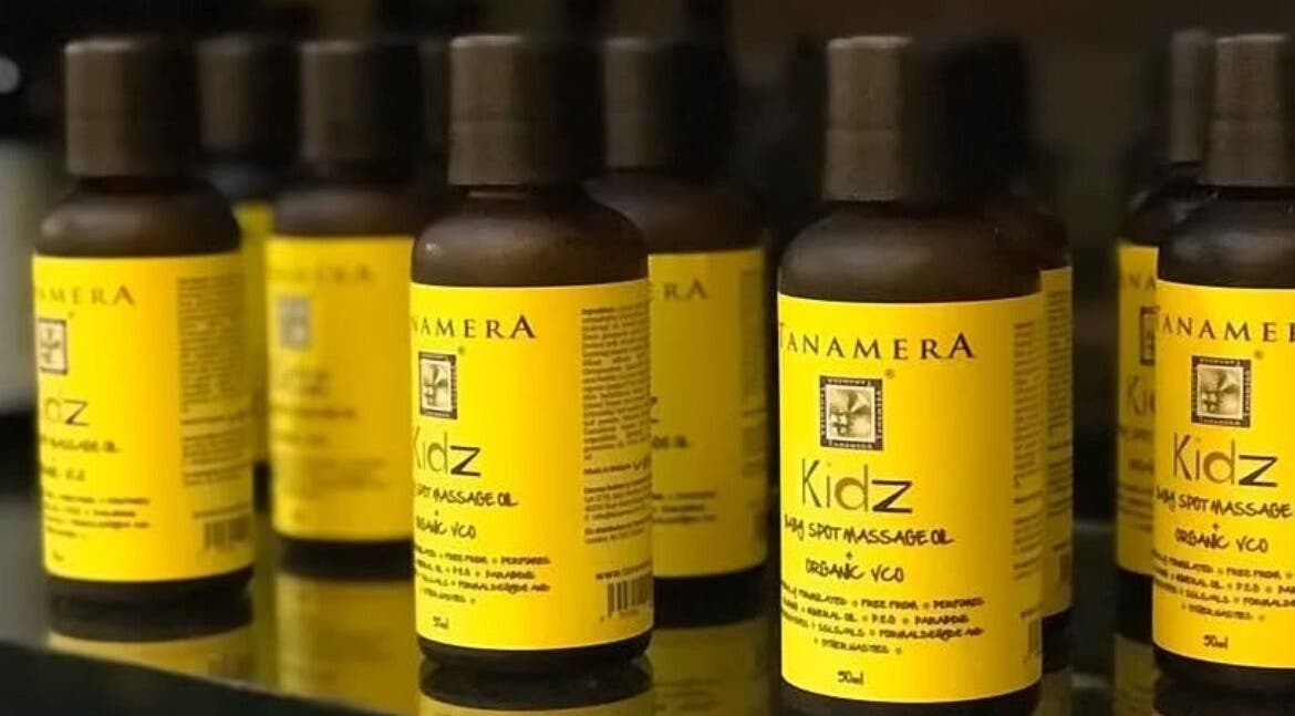 Display of Tanamera Spa Kemaman Arked massage oil bottles in Chukai, Terengganu, MY with vibrant labels.