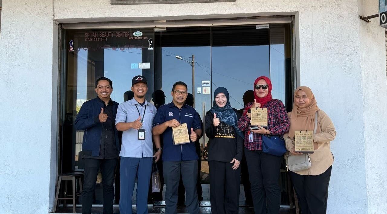 Tanamera Spa Kemaman Arked staff with awards at Chukai, Terengganu, MY entrance, promoting excellence.