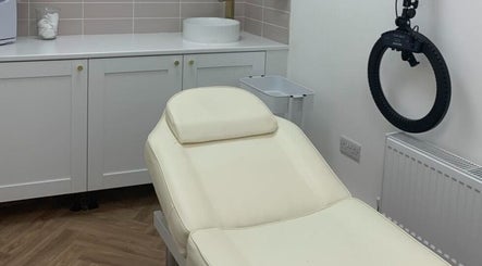 Cozy treatment room at Radiance Aesthetics Skin Clinic, Portsmouth, England, GB, showcasing a plush therapy chair.