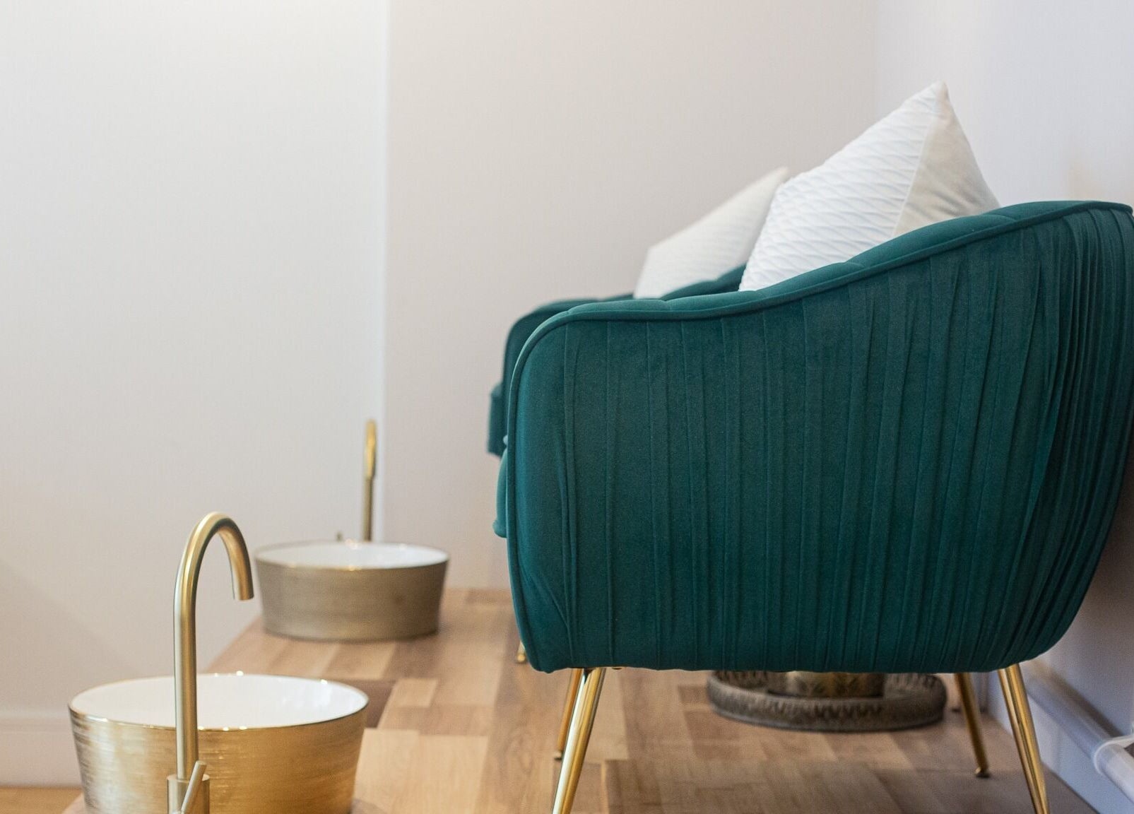 Elegant teal seats in the relaxation area at River and Rose, Dartmouth, England, GB, ready for a pampering experience.