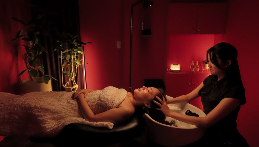 Relaxing head massage at Maris Gina, Shibuya City, Tokyo, JP. Experience tranquility and wellness in style.