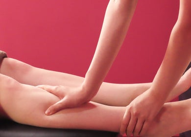 Therapist giving a relaxing leg massage at Maris Gina, Shibuya City, Tokyo, JP.