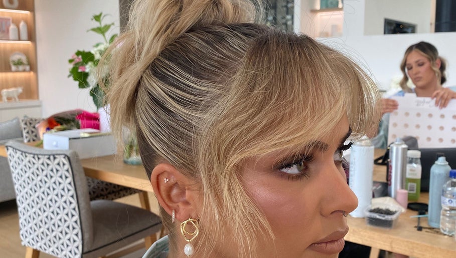 Elegant blonde updo hairstyle at Molly Sarah Hair, Ballarat Central, Victoria, AU, showcasing salon's style.