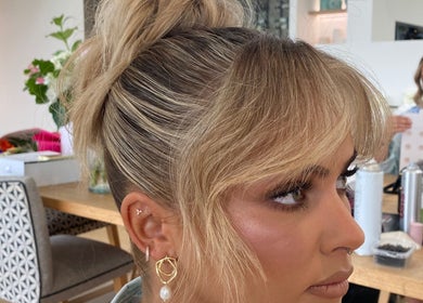 Elegant blonde updo hairstyle at Molly Sarah Hair, Ballarat Central, Victoria, AU, showcasing salon's style.