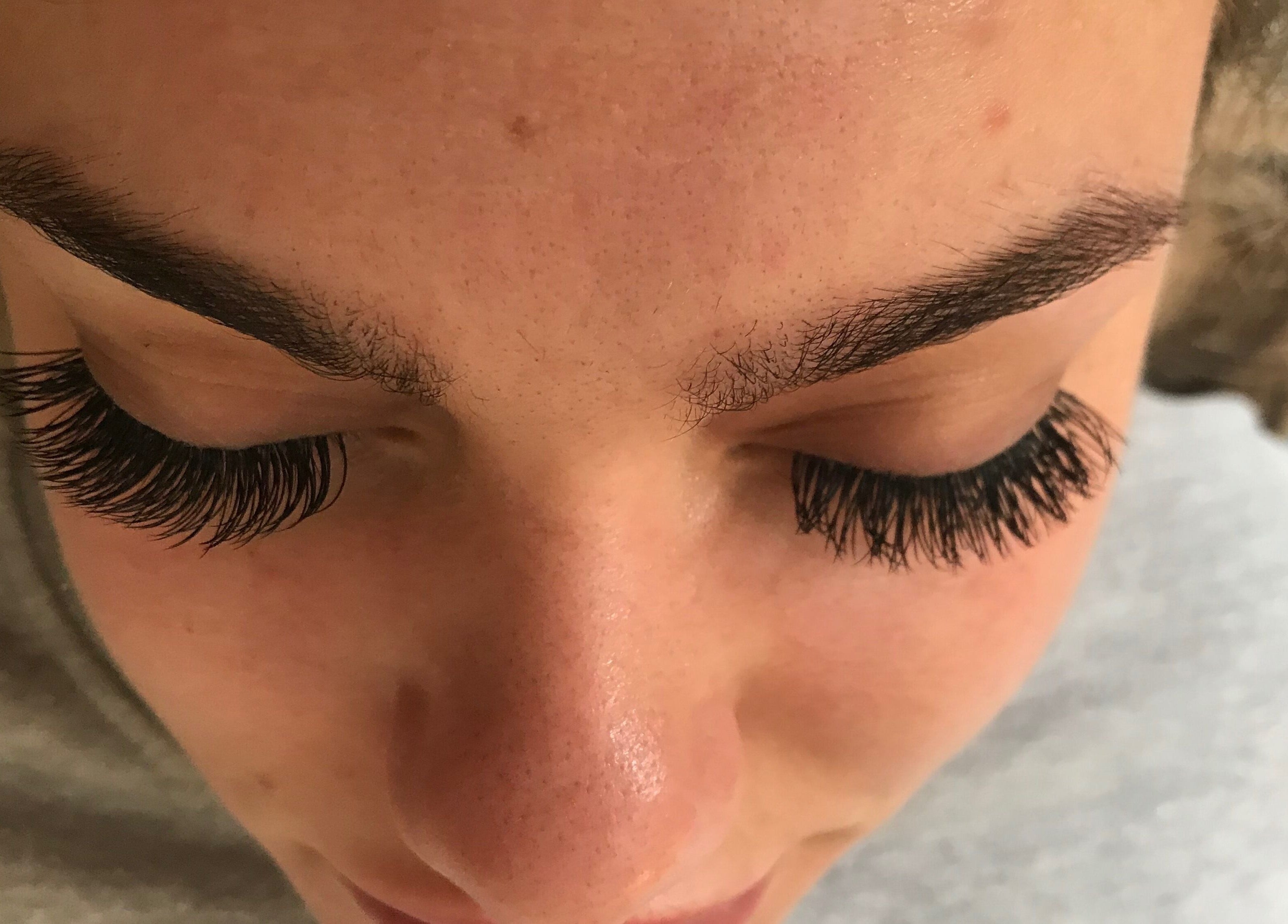 Close-up of exquisite eyelash extensions at Emily’s Beauty, Havant, England, GB, showcasing professional care.