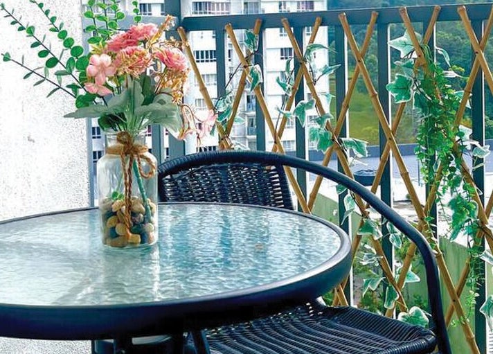 Relaxing balcony with flowers at Belaian Emas Spa, Putrajaya, Putrajaya, MY offering a tranquil ambiance.