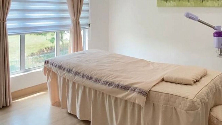 Tranquil massage room at Belaian Emas Spa, Cybersouth, Selangor, MY with natural light and soothing colors.