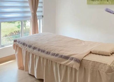Tranquil massage room at Belaian Emas Spa, Cybersouth, Selangor, MY with natural light and soothing colors.