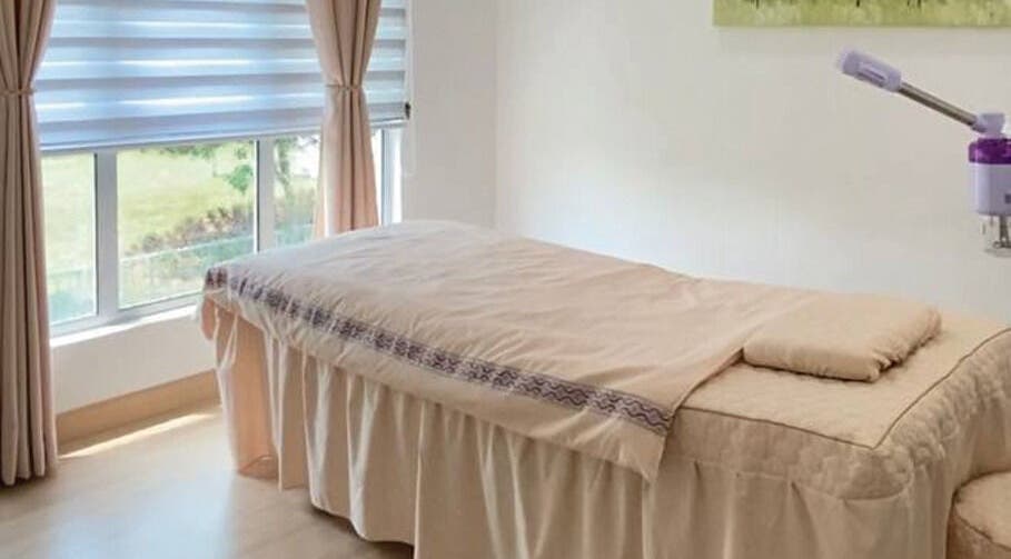 Tranquil massage room at Belaian Emas Spa, Cybersouth, Selangor, MY with natural light and soothing colors.