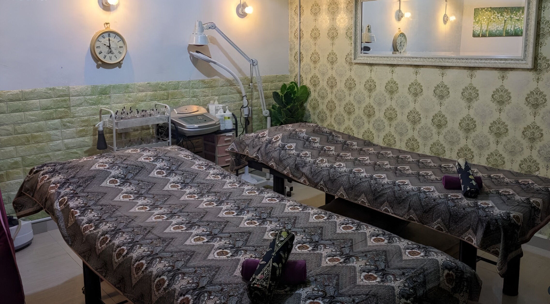 Tranquil spa room at Belaian Emas Spa, Hulu Selangor, Kuala Kubu Baru, Selangor, MY with cozy massage tables.