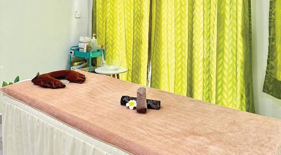 Tranquil massage bed at Belaian Emas Spa, Puncak Alam, Selangor, MY, perfect for relaxation.