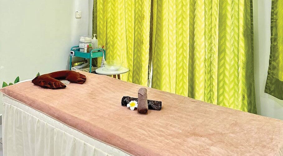 Tranquil massage bed at Belaian Emas Spa, Puncak Alam, Selangor, MY, perfect for relaxation.