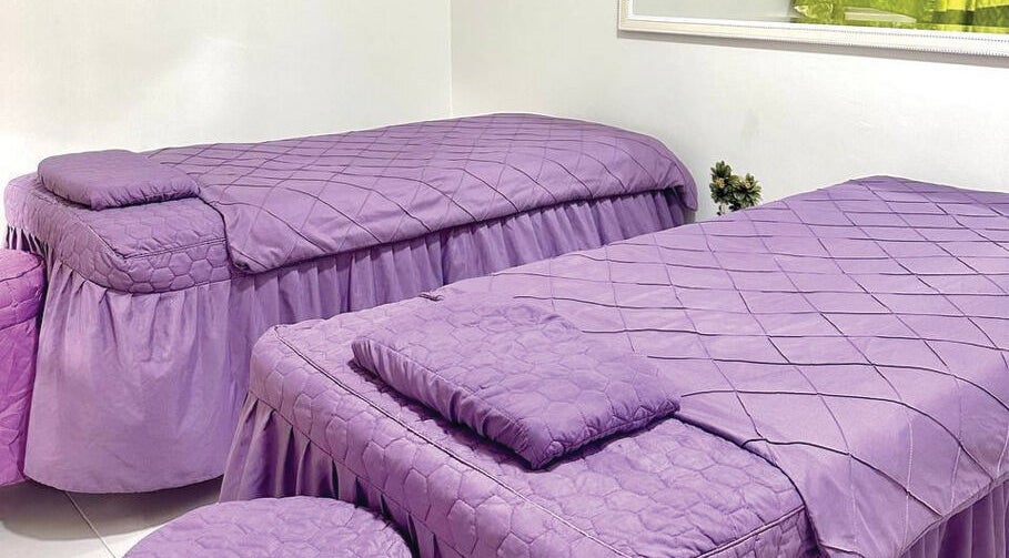 Lavender massage beds at Belaian Emas Spa, Puncak Alam, Selangor, MY offer a peaceful retreat.