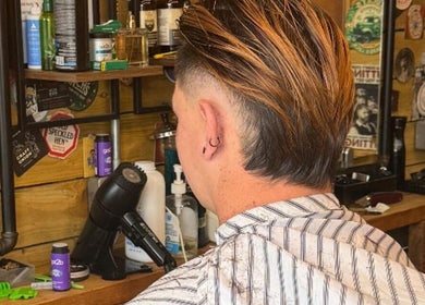 Stylish haircut at Bell St. Barbers in North Shields, England, GB. Modern ambiance.