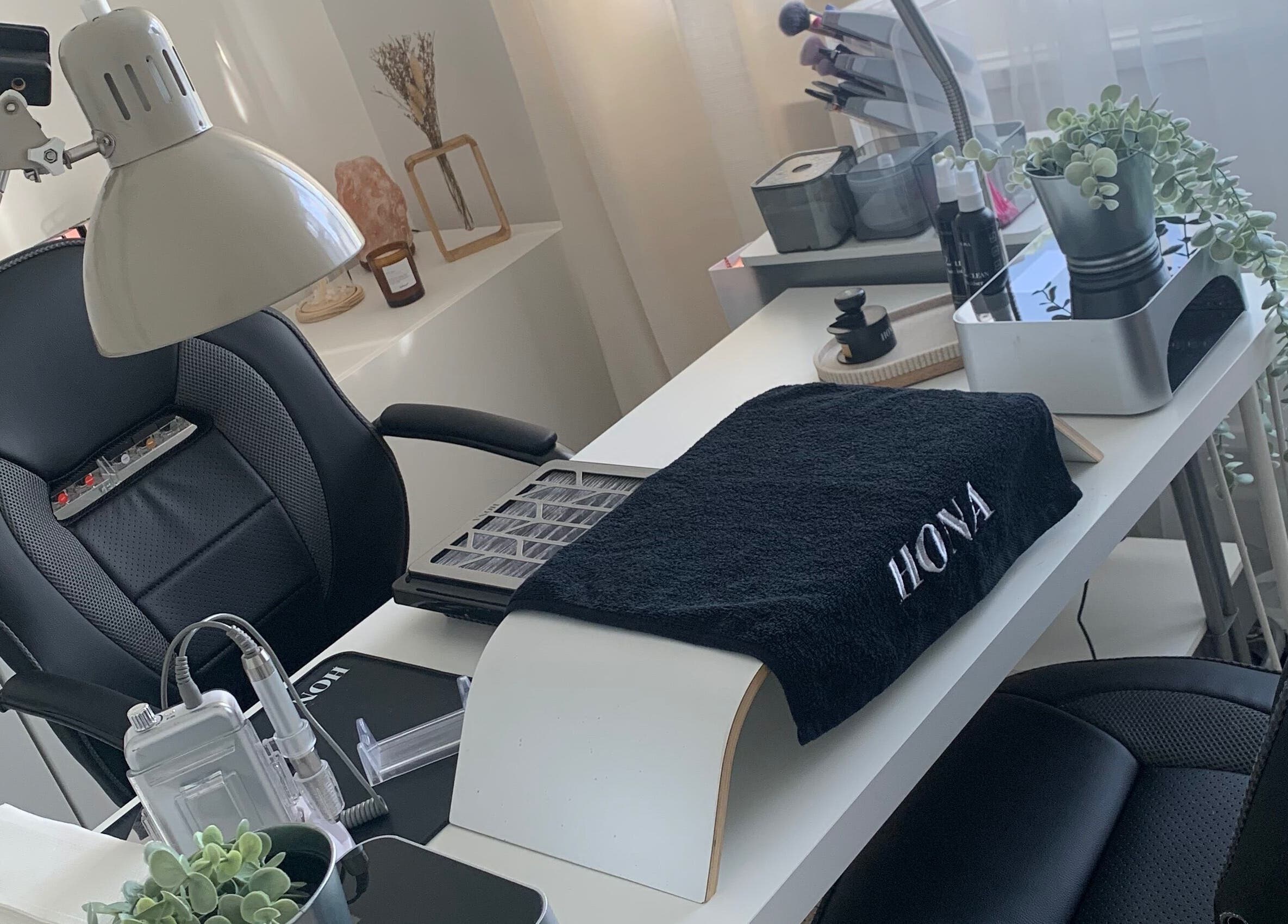 Stylish nail workspace at Nailicious by Vanessa, Stockport, GB, featuring sleek chairs and beauty tools.