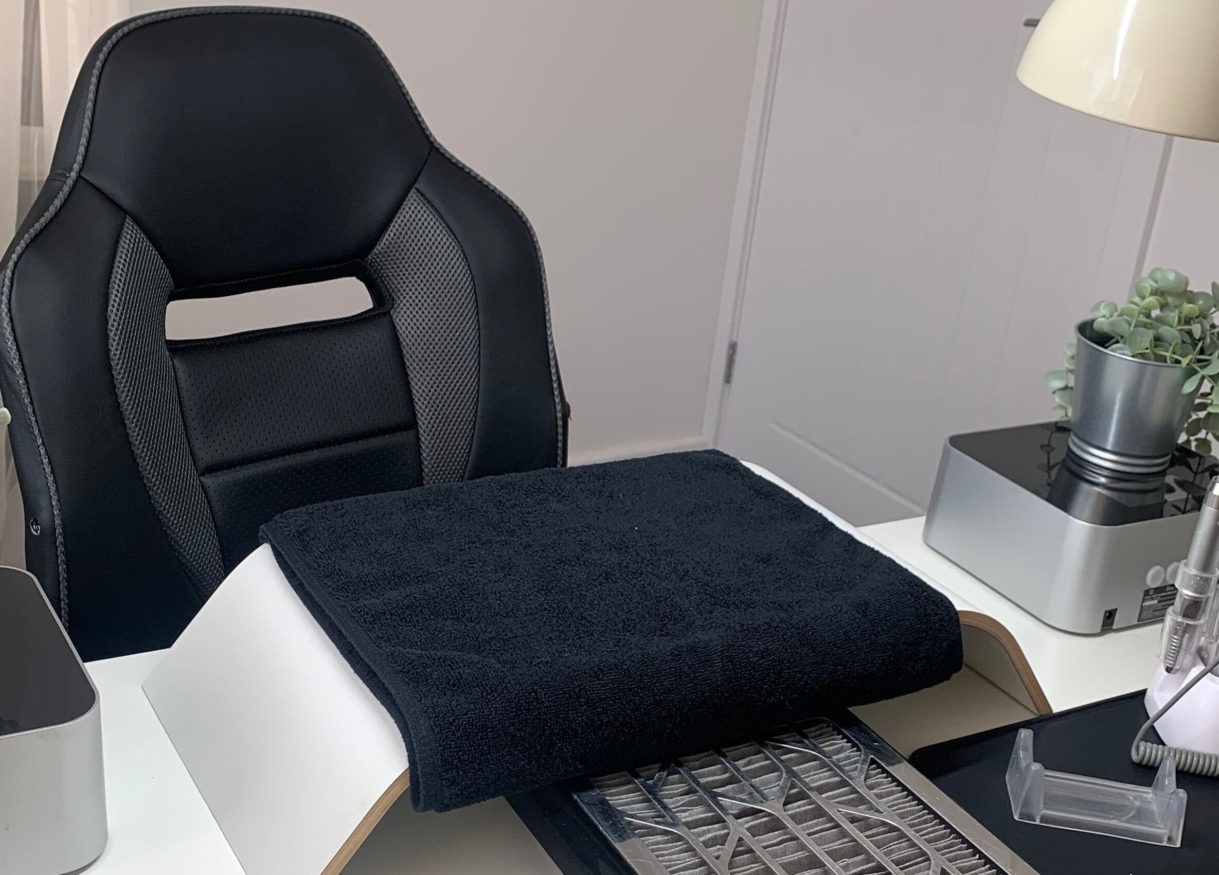 Elegant nail station at Nailicious by Vanessa in Stockport, GB, featuring modern tools and greenery.