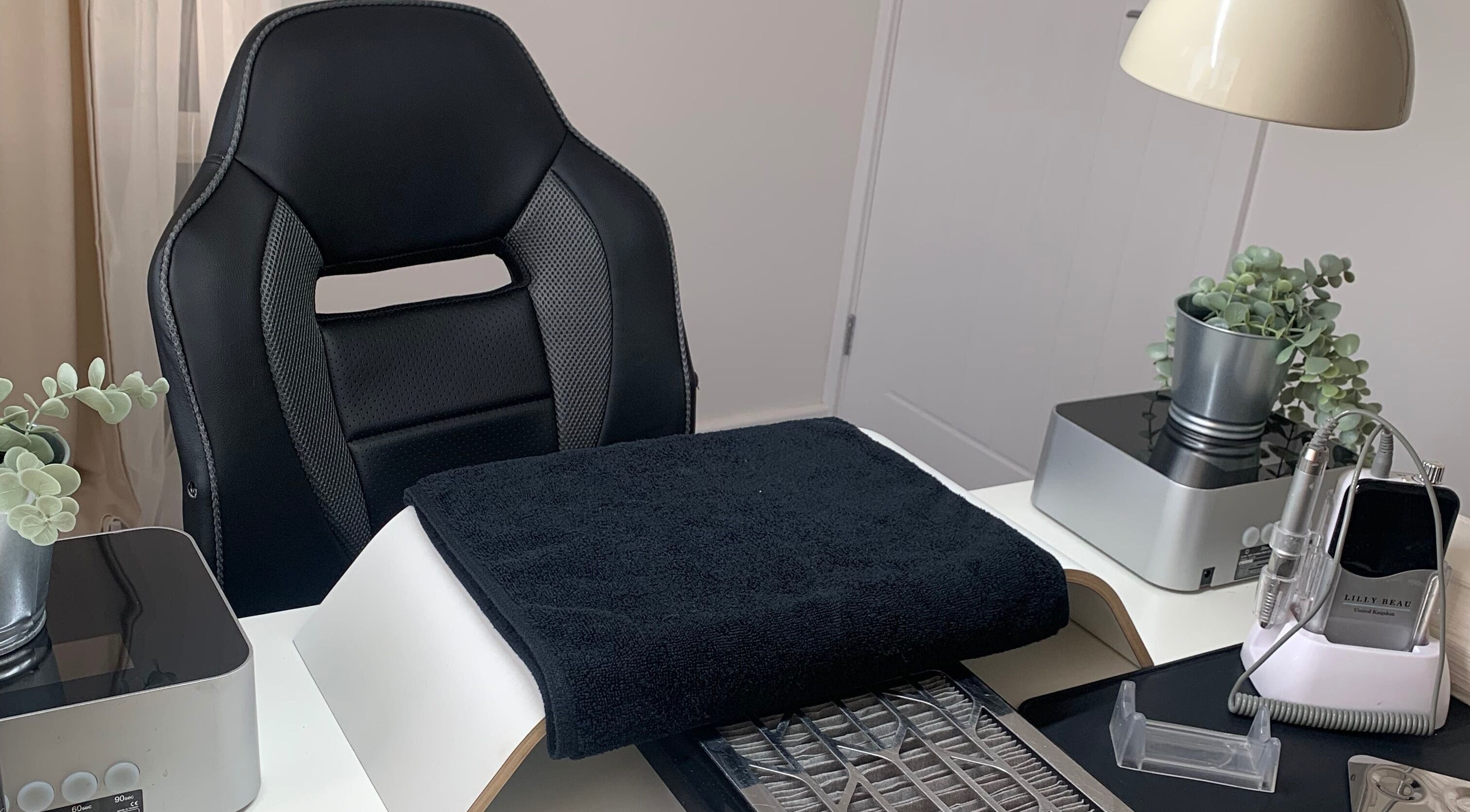 Elegant nail station at Nailicious by Vanessa in Stockport, GB, featuring modern tools and greenery.