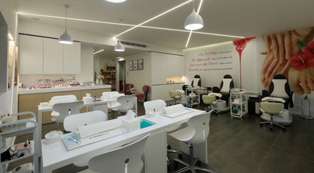 Modern, spacious interior of Annabelle Nail & Beauty Lounge in محافظة جبل لبنان, LB with sleek white stations.