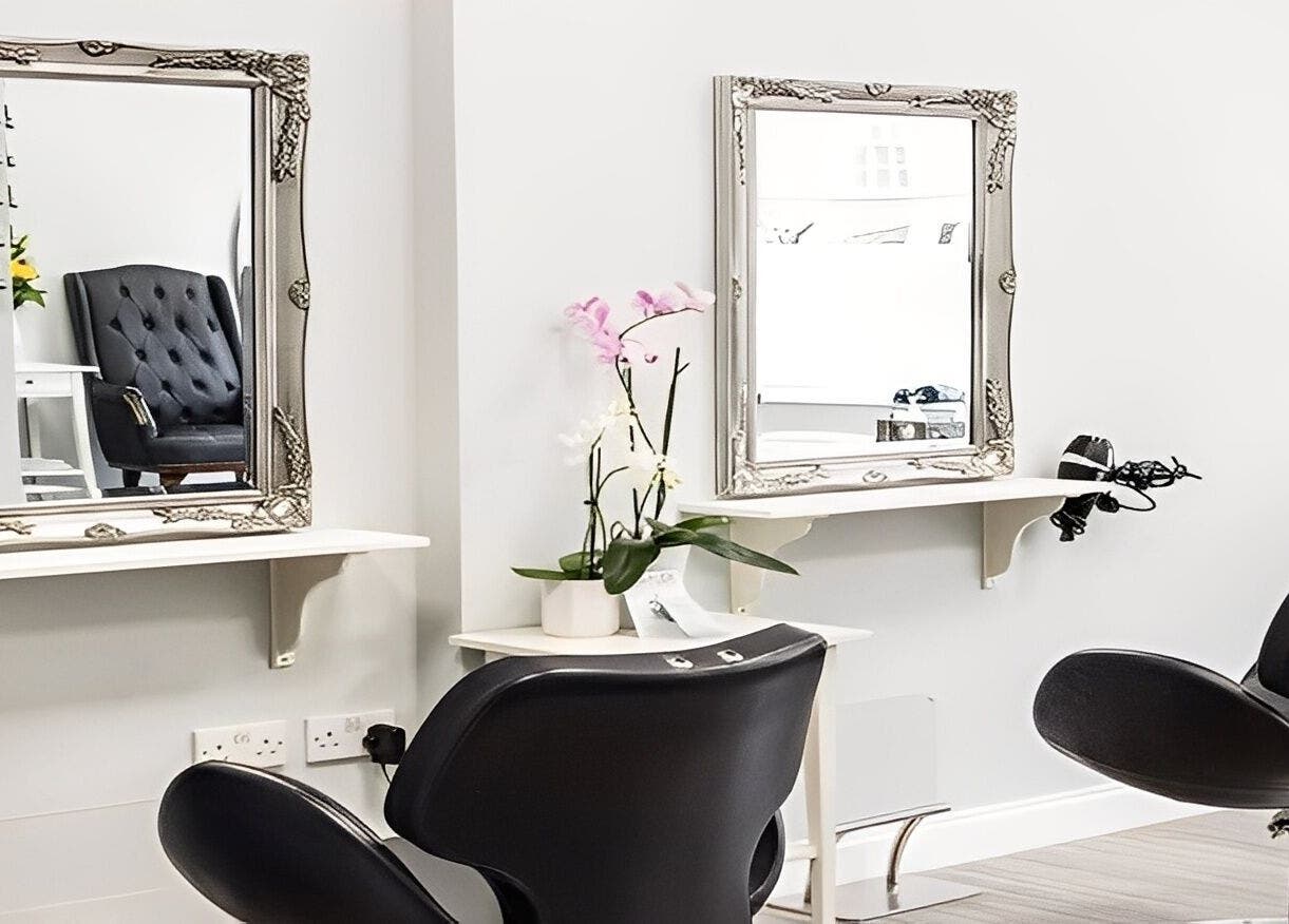 Modern styling chairs and mirrors at MiKa Salon in London, England, GB, showcasing elegance and tranquility.