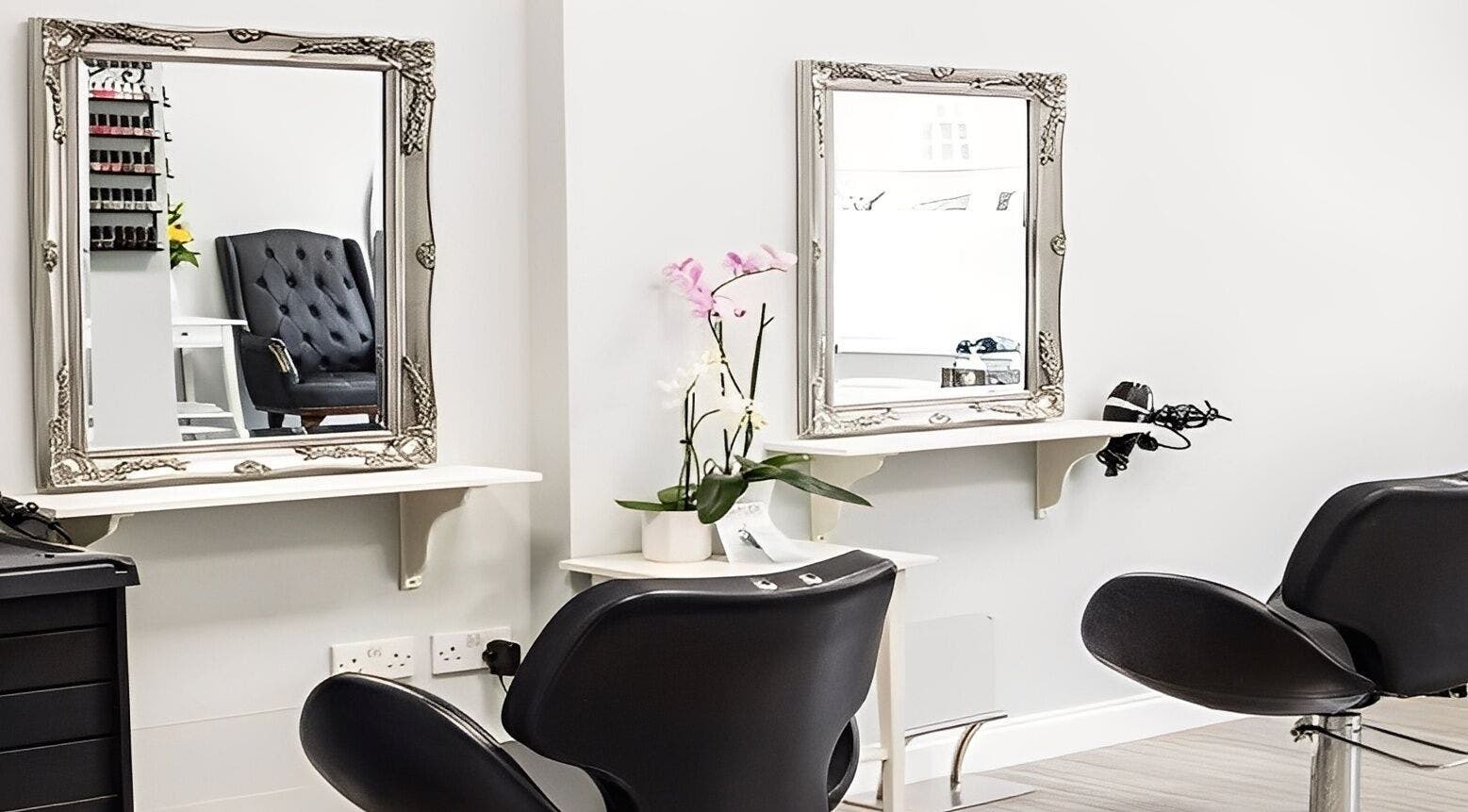 Modern styling chairs and mirrors at MiKa Salon in London, England, GB, showcasing elegance and tranquility.