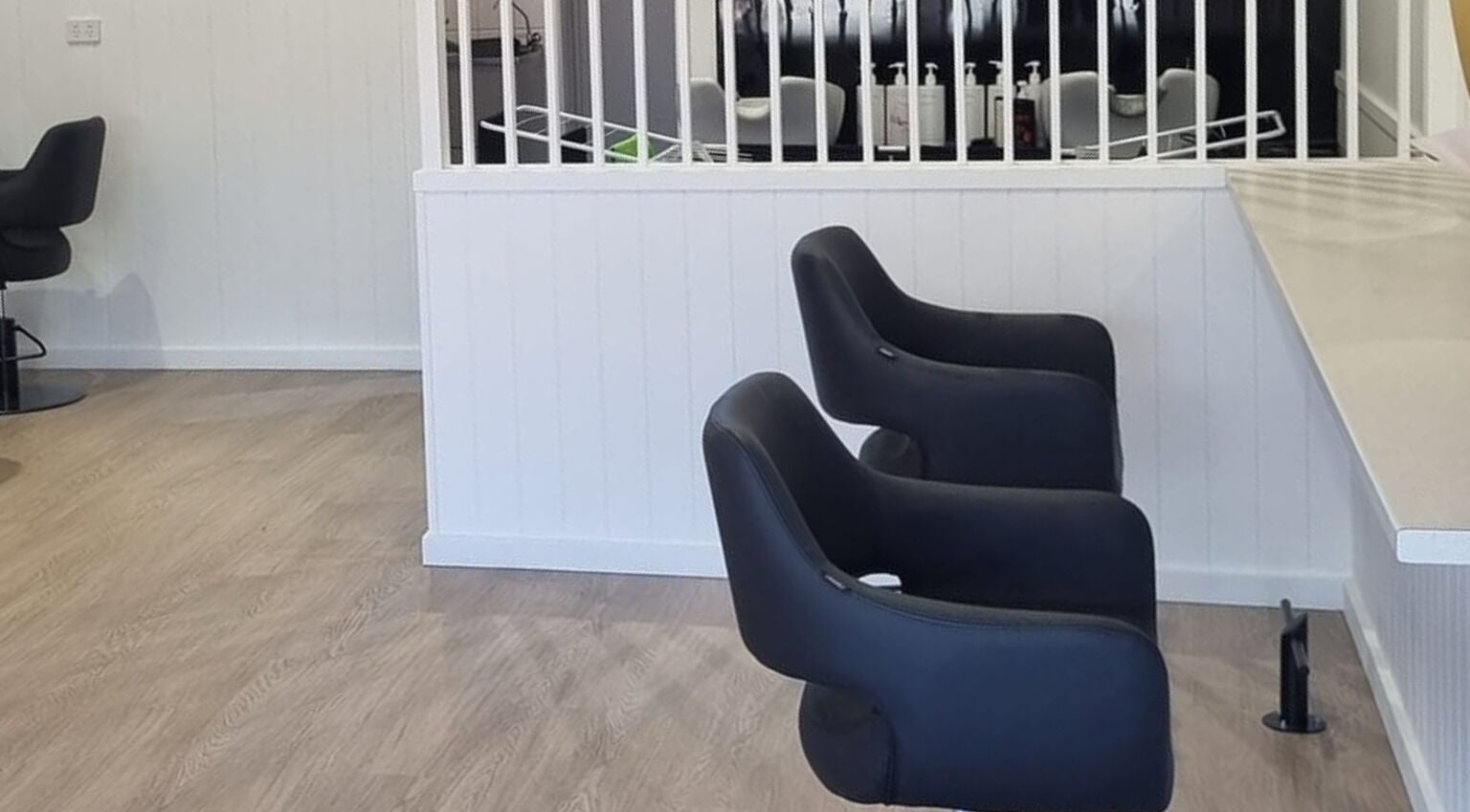 Modern salon chairs at Dalia Marie Hair, Fulham, South Australia, AU, showcasing a sleek interior design.