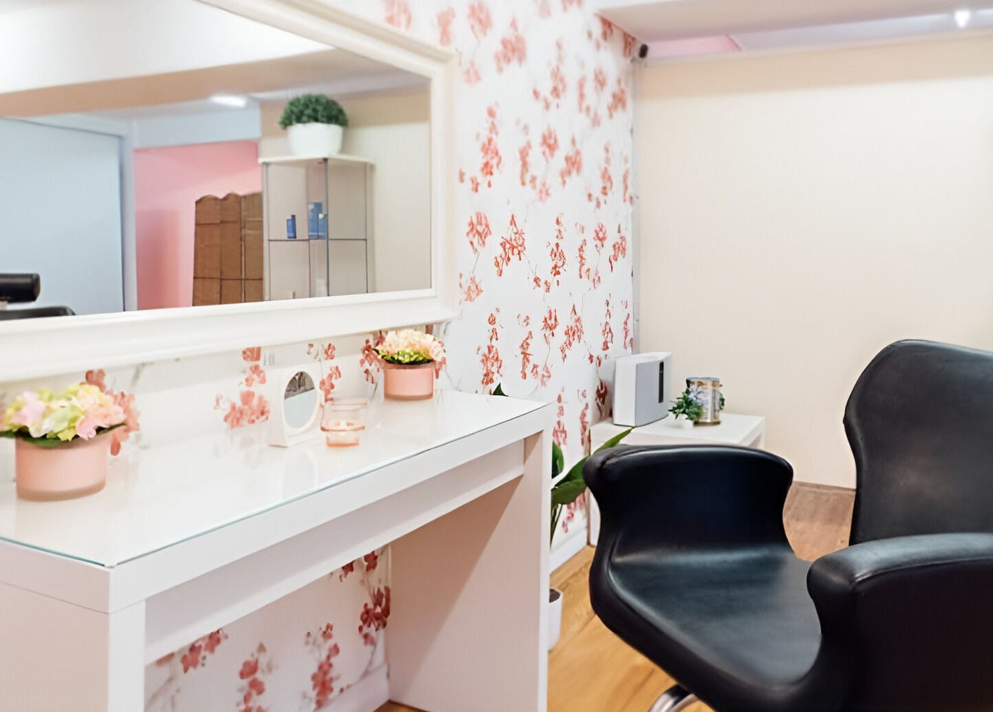 Stylish salon chair and floral decor at Glitzy Glam Beauty Salon, Holland Park West, Queensland, AU.