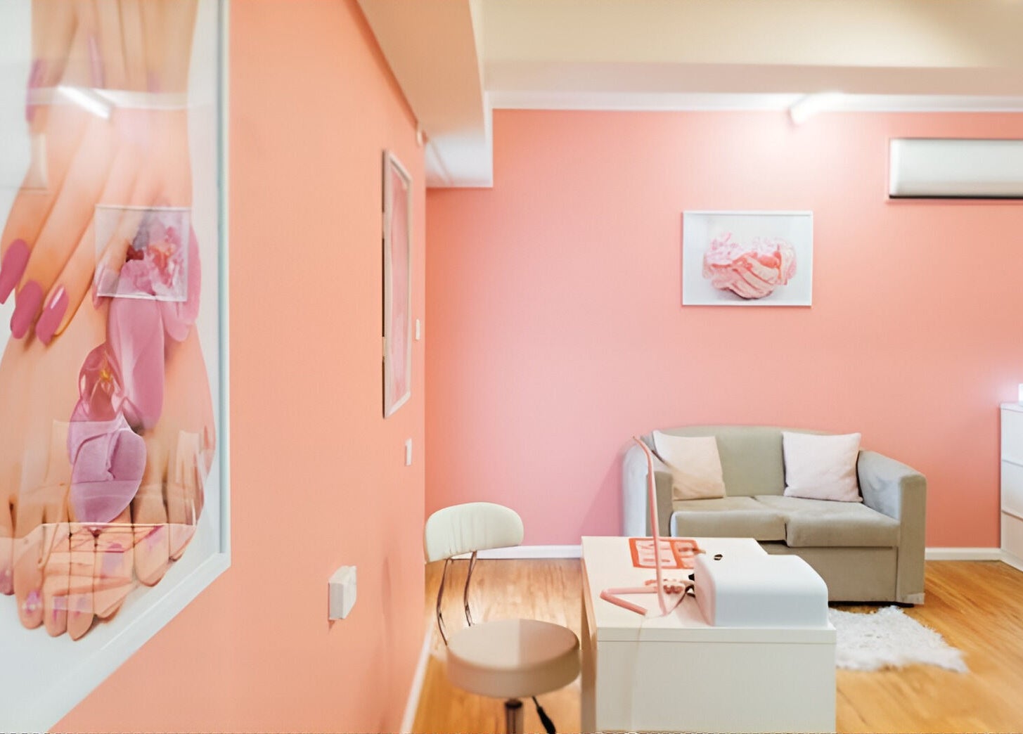 Inviting interior of Glitzy Glam Beauty Salon, Holland Park West, Queensland, AU, with peach walls and cozy seating.