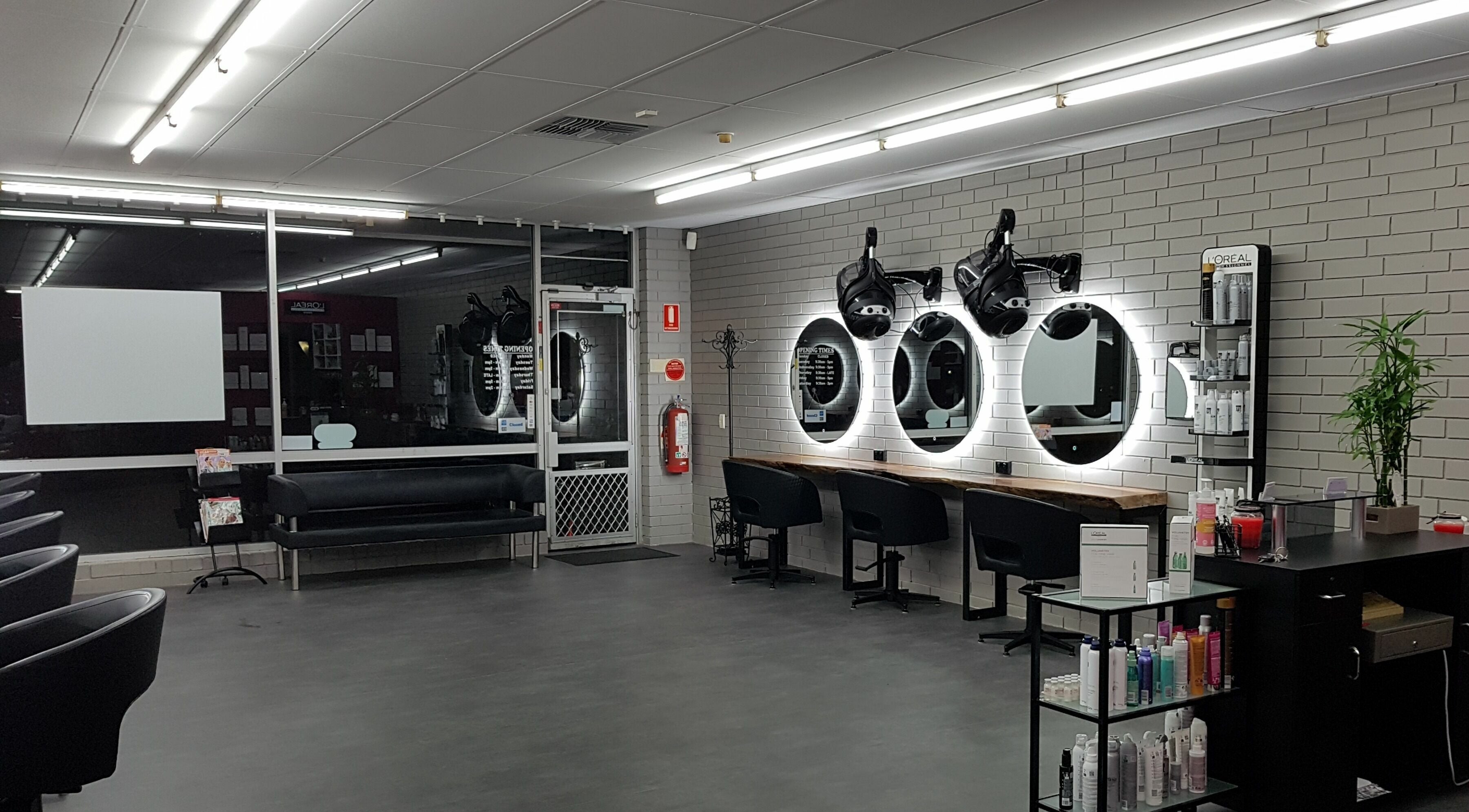 Modern interior of My Vision Hair in Hackham, South Australia, AU showcasing styling stations and products.