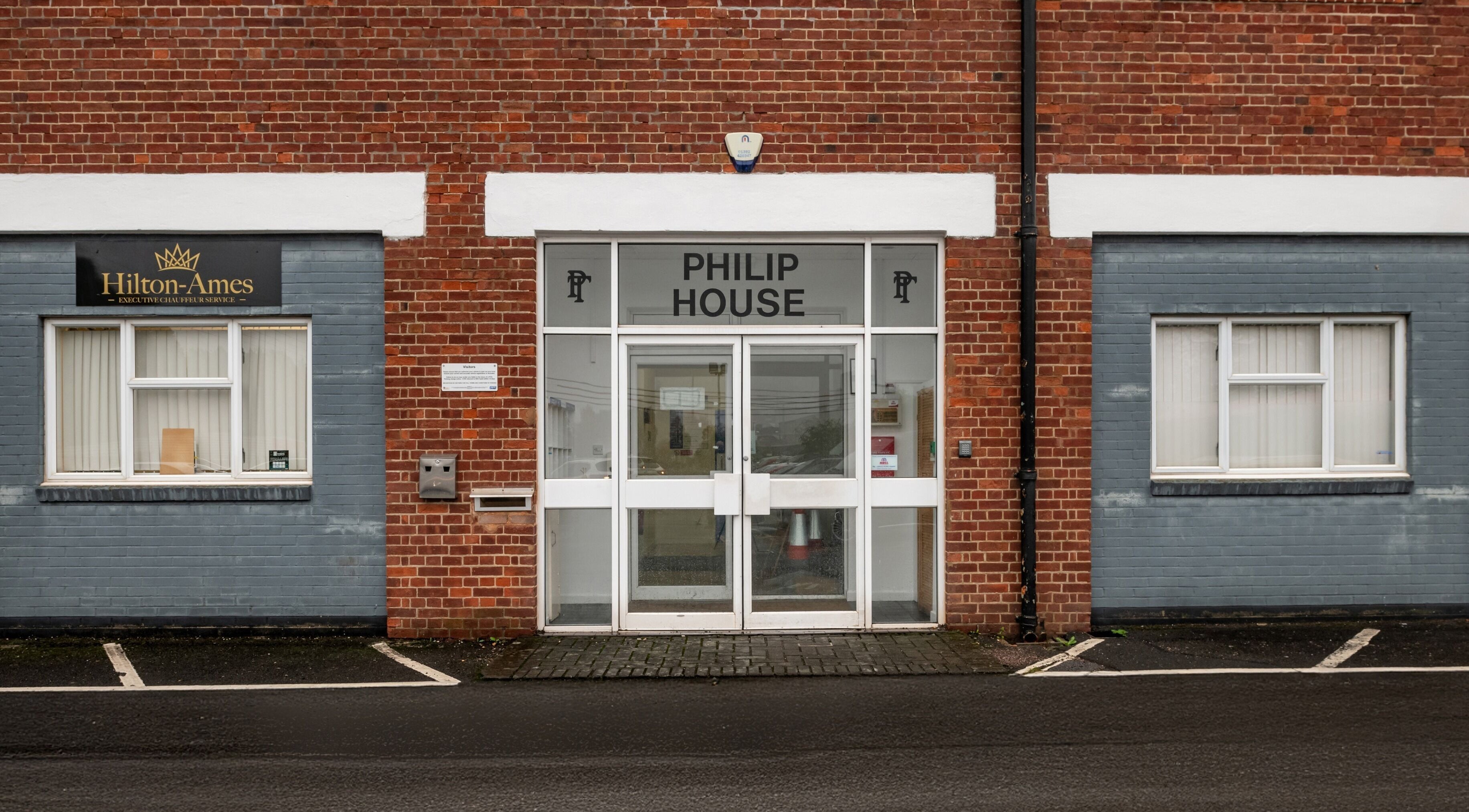Entrance to Bree Spivey Cosmetics at Philip House, Exeter, England, GB, showcasing a modern brick facade.