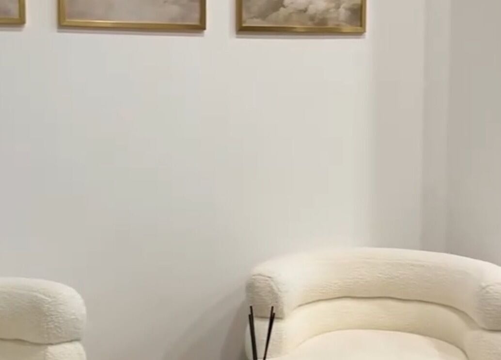 Elegant lounge area at Ellie at Cloud & Co, Hinckley, England, GB featuring plush seating and serene wall art.