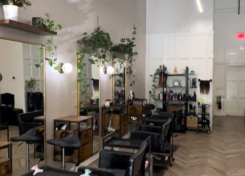 Elegant interior of Color by Gia x Vion Boutique Salon in Boca Raton, Florida, US showcasing styling stations.