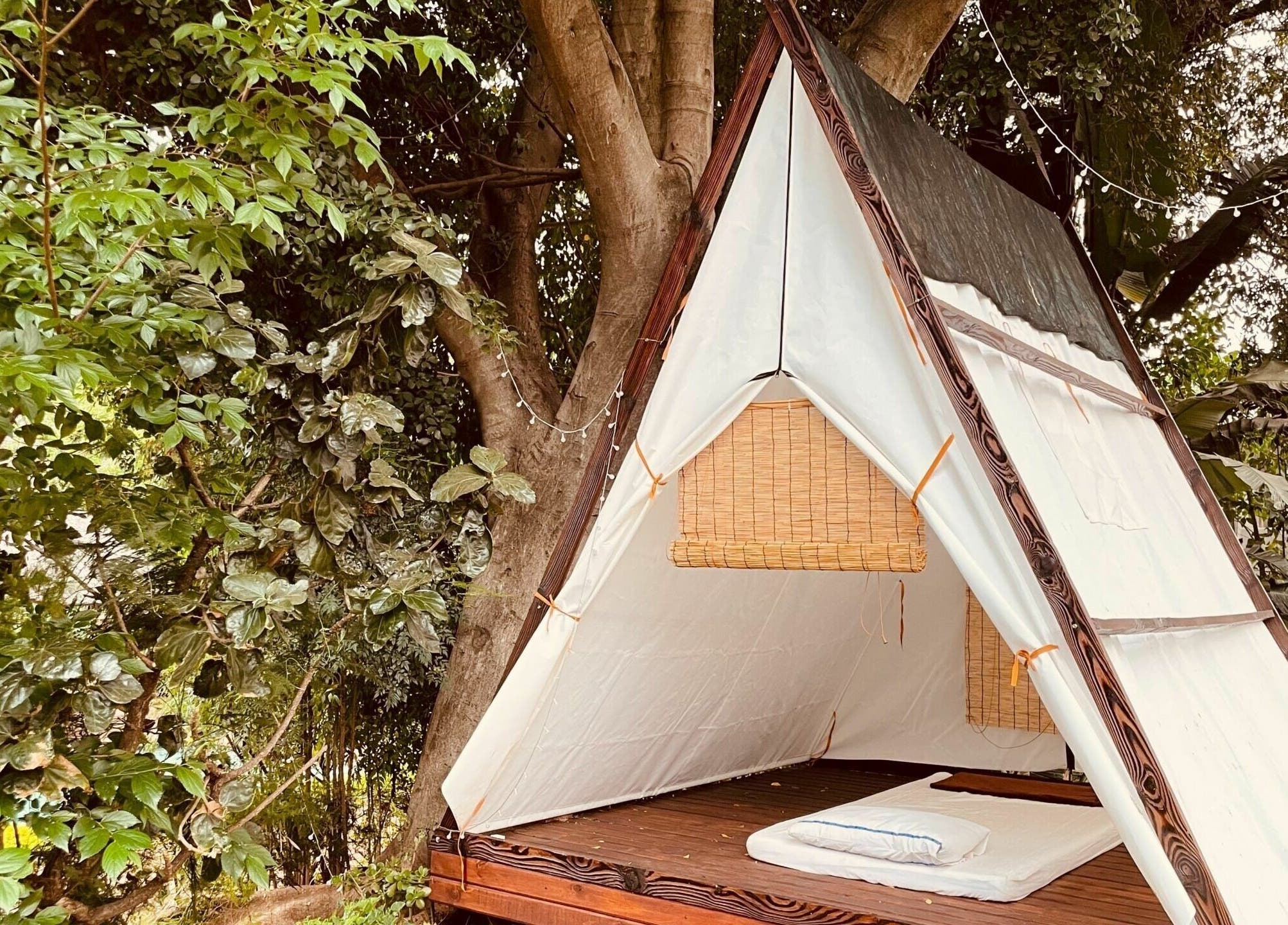 Outdoor relaxation tent at Sweet Face Thai Health Centre, Pretoria, Gauteng, ZA under lush trees.