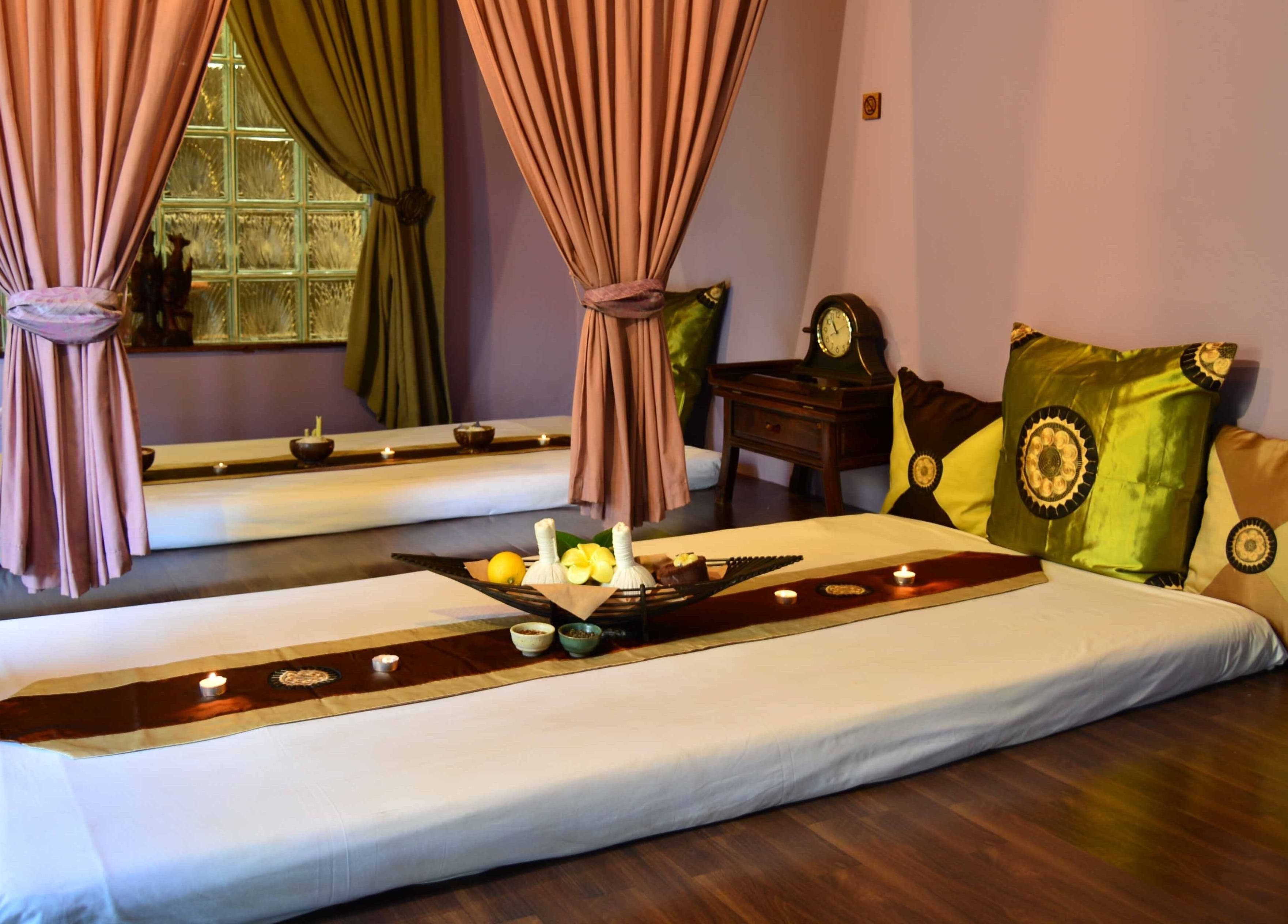 Cozy massage beds at Sweet Face Thai Health Spa, Pretoria, Gauteng, ZA, with elegant drapes and soothing decor.