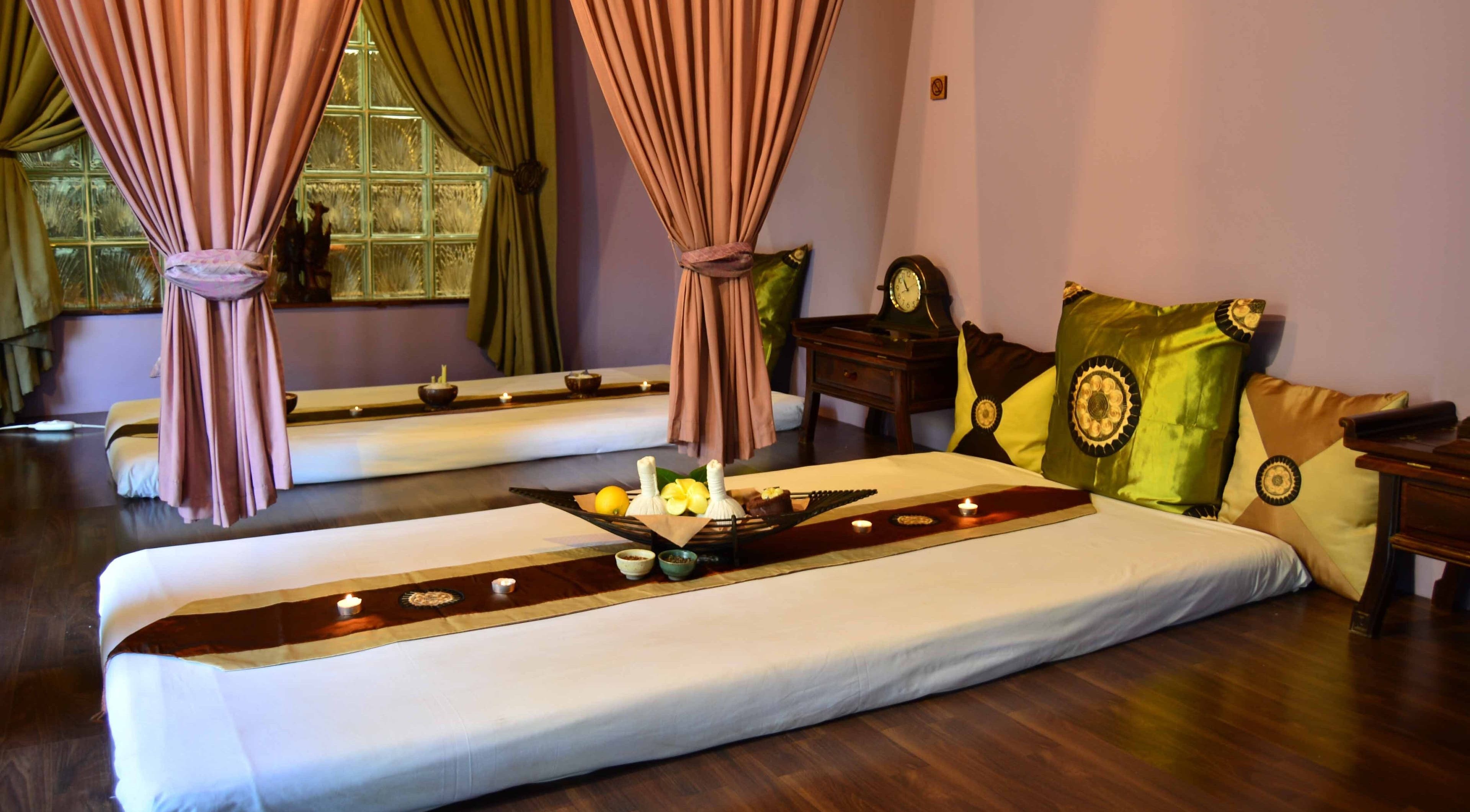 Cozy massage beds at Sweet Face Thai Health Spa, Pretoria, Gauteng, ZA, with elegant drapes and soothing decor.