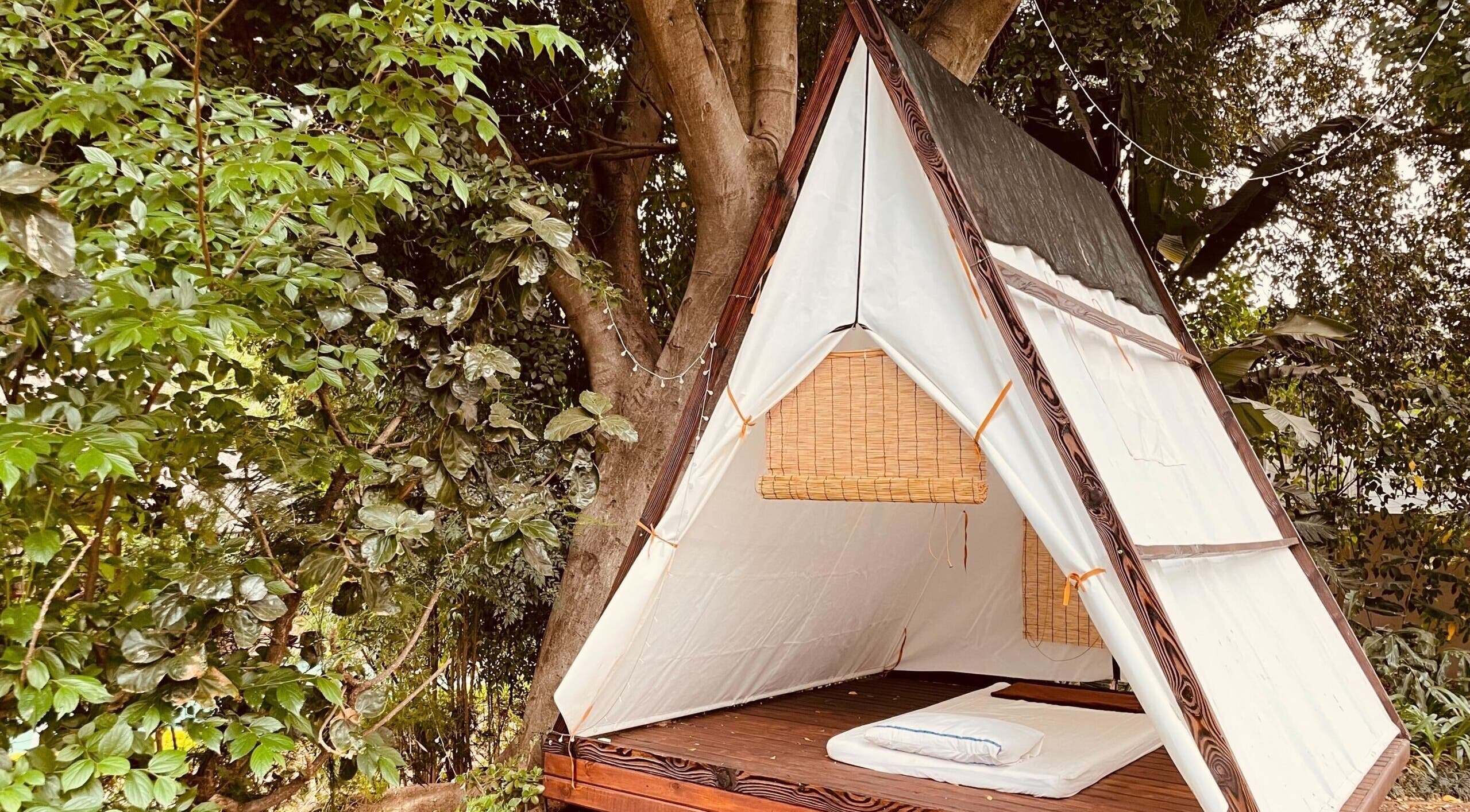 Cozy outdoor tent at Sweet Face Thai Health Spa, Pretoria, Gauteng, ZA amidst lush greenery for relaxation.