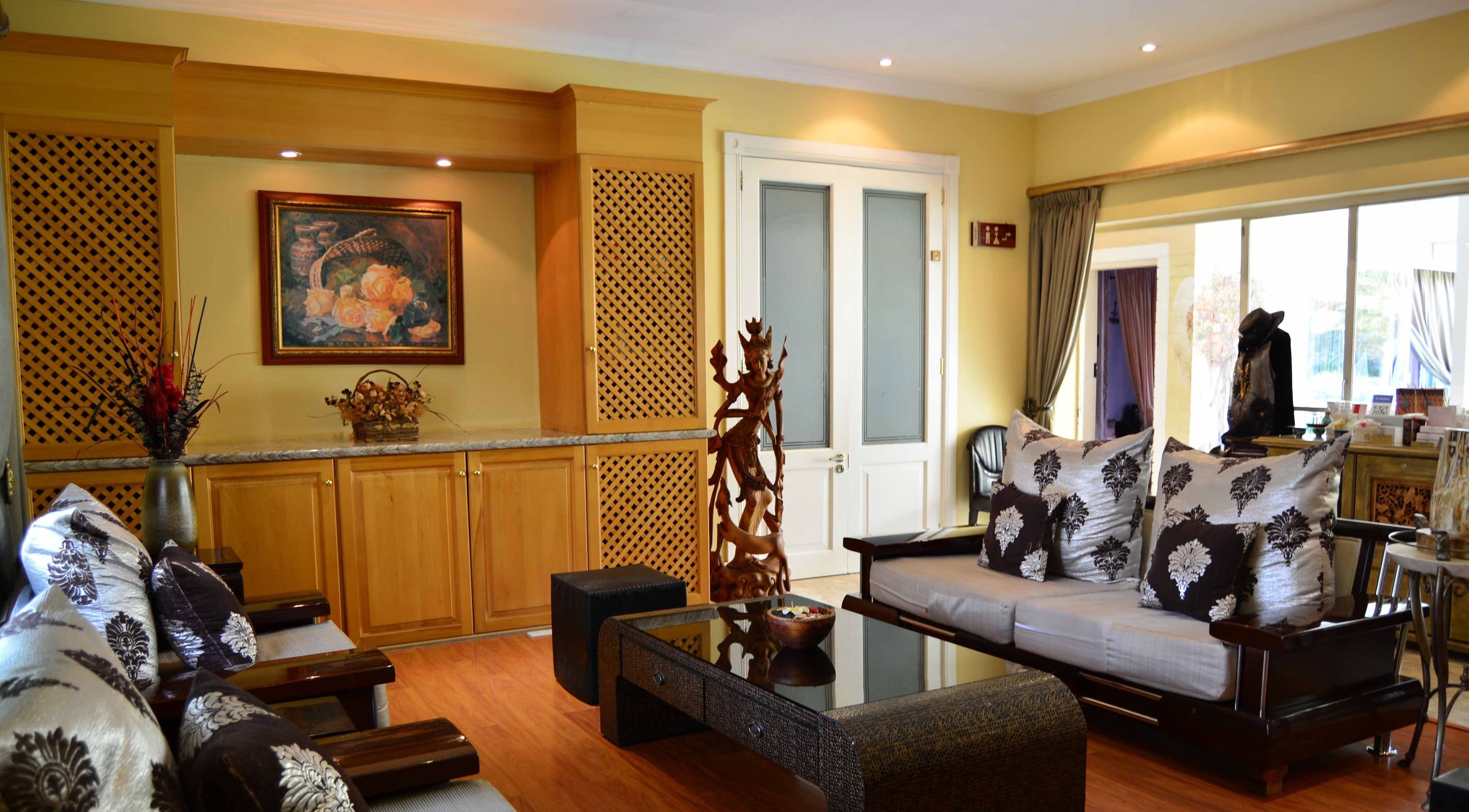 Elegant lounge area at Sweet Face Thai Health Spa, Pretoria, Gauteng, ZA, with stylish decor and soft lighting.